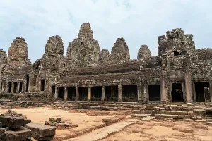 Southeast Prints: Exploring Bayon Temple with stone towers and ancient carvings in Siem Reap, Cambodia