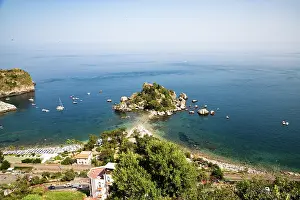 Taormina Prints: Exploring the beach and island at Taormina with blue water and boats in the background