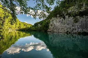 Trail Prints: Exploring the clear blue water and lush greenery at Plitvice Lakes National Park in Croatia during the day