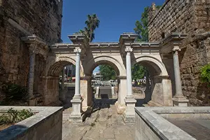 Antalya Prints: Exploring Hadrians Gate built in 130 AD located in Antalya Turkey surrounded by ancient architecture and modern life
