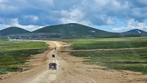 Vehicles Prints: Exploring the highland country roads of Qarabaqh in Azerbaijan between green hills and open skies
