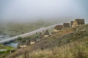 Burial Prints: Exploring a historic burial site in Dargavs surrounded by fog in the Caucasus mountains of North Ossetia