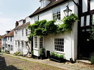 Mermaid Prints: Exploring a historic street with charming houses in Rye East Sussex during a sunny day