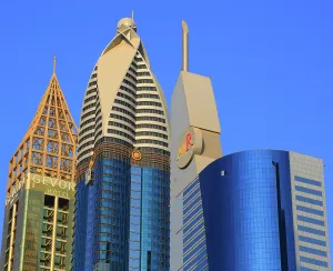 Glass Prints: Exploring modern architecture in Central Dubai with unique building designs and clear blue sky