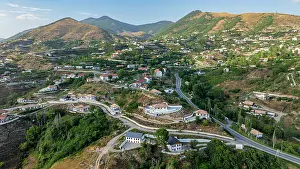 Homes Prints: Exploring the mountain resort of Lachin in Qarabaqh with views of landscape and buildings