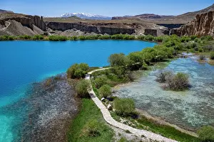 National Prints: Exploring multi colored lakes in Band-e-Amir National Park with clear blue water and lush green plants in Afghanistan