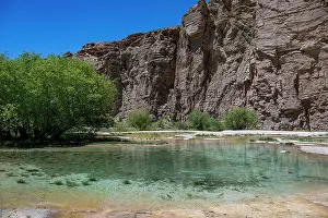 National Prints: Exploring the multi coloured lake at Band-e-Amir National Park in Afghanistan surrounded by rocky cliffs and greenery