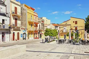 Cafes Prints: Exploring the narrow streets and colorful buildings of Ragusa Ibla in Sicily during a bright afternoon