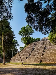 Trail Prints: Exploring the North Acropolis at Yaxha Archaeological Site in Guatemala under the clear sky