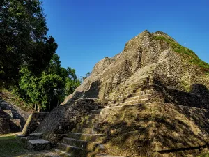 Stairs Prints: Exploring the North Acropolis at Yaxha Archaeological Site in Guatemala surrounded by nature and ancient structures