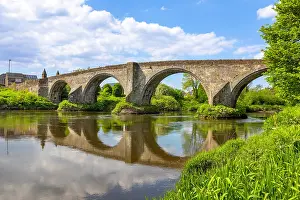 Riverside Prints: Exploring Old Stirling Bridge across the River Forth in Stirlingshire Scotland on a sunny day