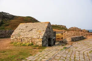 Preserved Prints: Exploring the old stone house at Fort Pezeries on Guernsey Island near the sea and hills