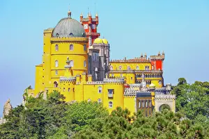 Residence Prints: Exploring Pena Palace rising above the trees in Sintra Portugal on a bright day with clear blue skies