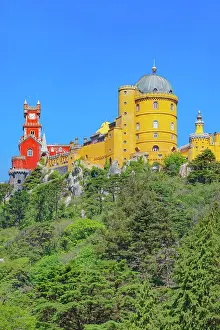 Route Prints: Exploring Pena Palace set against a clear blue sky in Sintra on a sunny day