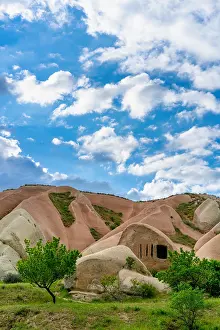 Cappadocia Prints: Exploring Pidgeon Valley cave nestled within unique rock formations in Cappadocia
