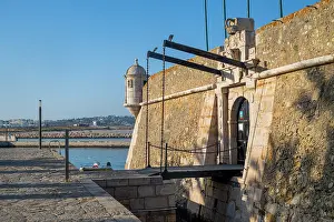 Small Prints: Exploring Ponta da Bandeira fort with views of the surrounding water and coastline in the Algarve region of Portugal
