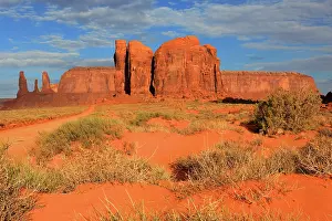 Dirt Prints: Exploring the red rock formations and wide landscape of Monument Valley under blue skies in Utah