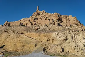 Mountainous Prints: Exploring the remains of ancient structures in Shahr-e-Gholghola in Afghanistan under a clear blue sky