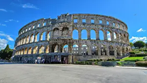 Amphitheatre Prints: Exploring the Roman amphitheatre in Pula during a sunny day in Istria, Croatia