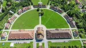 Significance Prints: Exploring the Royal Saltworks at Arc-et-Senans through aerial view showcasing the layout and structures in France