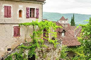 Cobblestone Prints: Exploring the rustic architecture and greenery in a beautiful village in southwest France during daytime