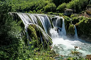 Fresh Prints: Exploring Strbacki buk waterfall and its natural surroundings in Una National Park during a sunny day in Bosnia