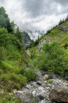 Trail Prints: Exploring Tschinglengorge in Sardona National Park during a cloudy day in Elm, Switzerland