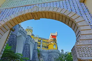 Sintra Prints: Exploring the unique architecture and colorful features of Pena Palace set against a clear blue sky