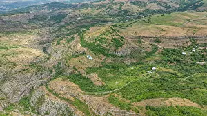 Wonders Prints: Exploring the vast landscape of a canyon in Qarabaqh with green valleys and rugged terrain in Azerbaijan