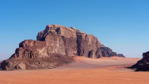 Dunes Prints: Exploring the vast landscape of Wadi Rum desert in Jordan with its unique rock formations and endless sandy dunes
