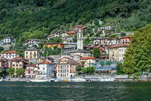 Crafts Prints: Exploring the waterfront of Lenno with colorful buildings along Lake Como in Italy