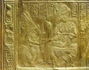 Gilt Prints: Detail of the exterior of the gilt shrine showing the king pouring perfumed liquid into the queens hand