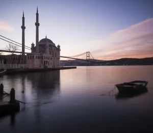 Rowing Boat Prints: Exterior of Ortakoy Mosque and Bosphorus bridge at dawn, Ortakoy, Istanbul, Turkey