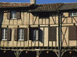 Timber Prints: Exterior of timber framed houses with shutters, in Lautrec in Tarn, Midi-Pyrenees France