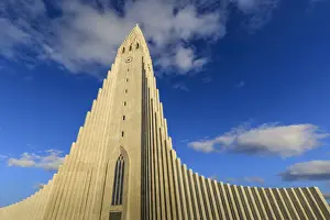 Time Prints: Exterior view of Hallgrimskirkja, the largest Lutheran church in Reykjavik, blue sky