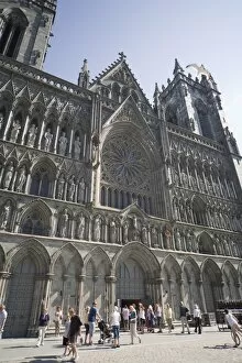 Exterior of the west front, with seagull flying over, Nidaros Cathedral