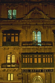 Valetta Prints: Part of the facade of an ancient palace illuminated