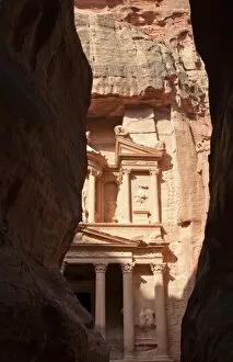 Images Dated 13th April 2011: The facade of the Treasury (Al Khazneh) carved into the red rock, seen from the Siq, Petra