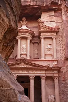 Classical Style Prints: The facade of the Treasury (Al Khazneh) carved into the red rock with the Siq in the foreground
