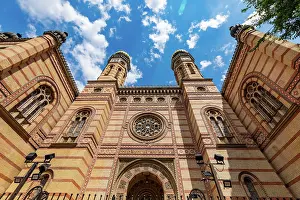 Budapest Prints: Facade and twin towers of Dohny Street Synagogue in Budapest under blue sky with clouds