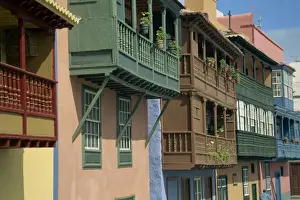 Facades of painted houses with overhanging wooden balconies in Santa Cruz de la Palma
