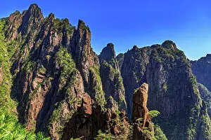 Face Prints: Face stone in Huangshan mountains under a clear blue sky in Anhui Province, China