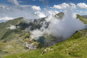Romania Prints: Fagaras mountains and Balea lake in Romania with clouds and greenery visible in the landscape