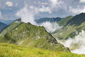 Romania Prints: Fagaras Mountains view over Balea Lake showing rocky peaks and dense clouds in Romania