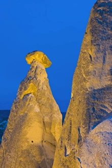 Fairy chimneys known as The Three Beauties illuminated at night near Goreme Fairy chimneys known as The Three Beauties illuminated at night near Goreme