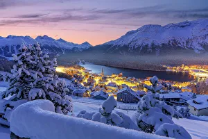 Engadine Prints: Fairy tale view of Saint Moritz on a snowy winter dusk