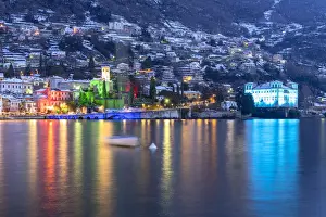Lake Como Prints: Fairy tale village of Gravedona illuminated with Christmas Lights during a snowy winter