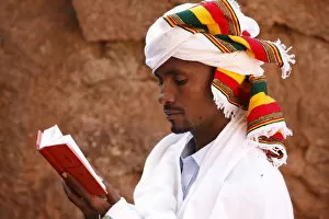 Images Dated 25th February 2010: Faithful reading outside a church in Lalibela, Ethiopia, Africa
