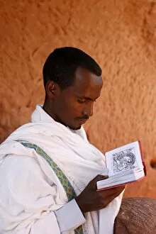 Images Dated 27th February 2010: Faithful reading outside a church in Lalibela, Ethiopia, Africa
