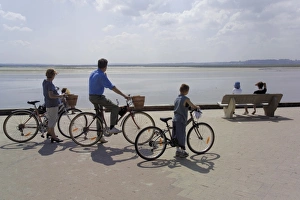 Picardie Prints: Family on bicycles, Le Crotoy, Somme Estuary, Picardy, France, Europe